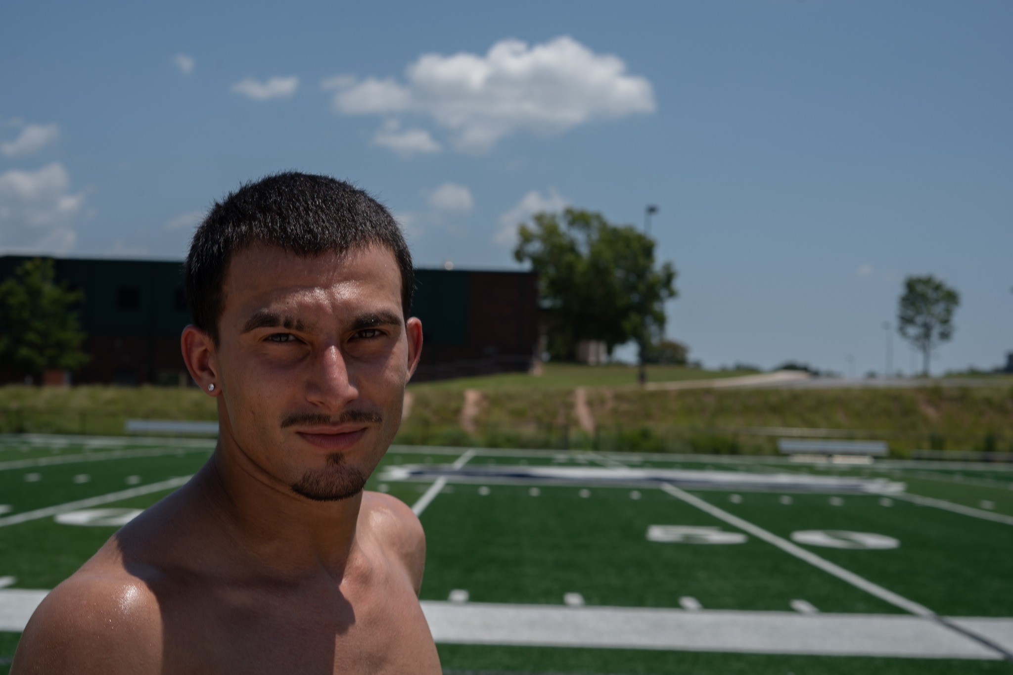 Athlete portrait on the field — photography by Andrew Frady