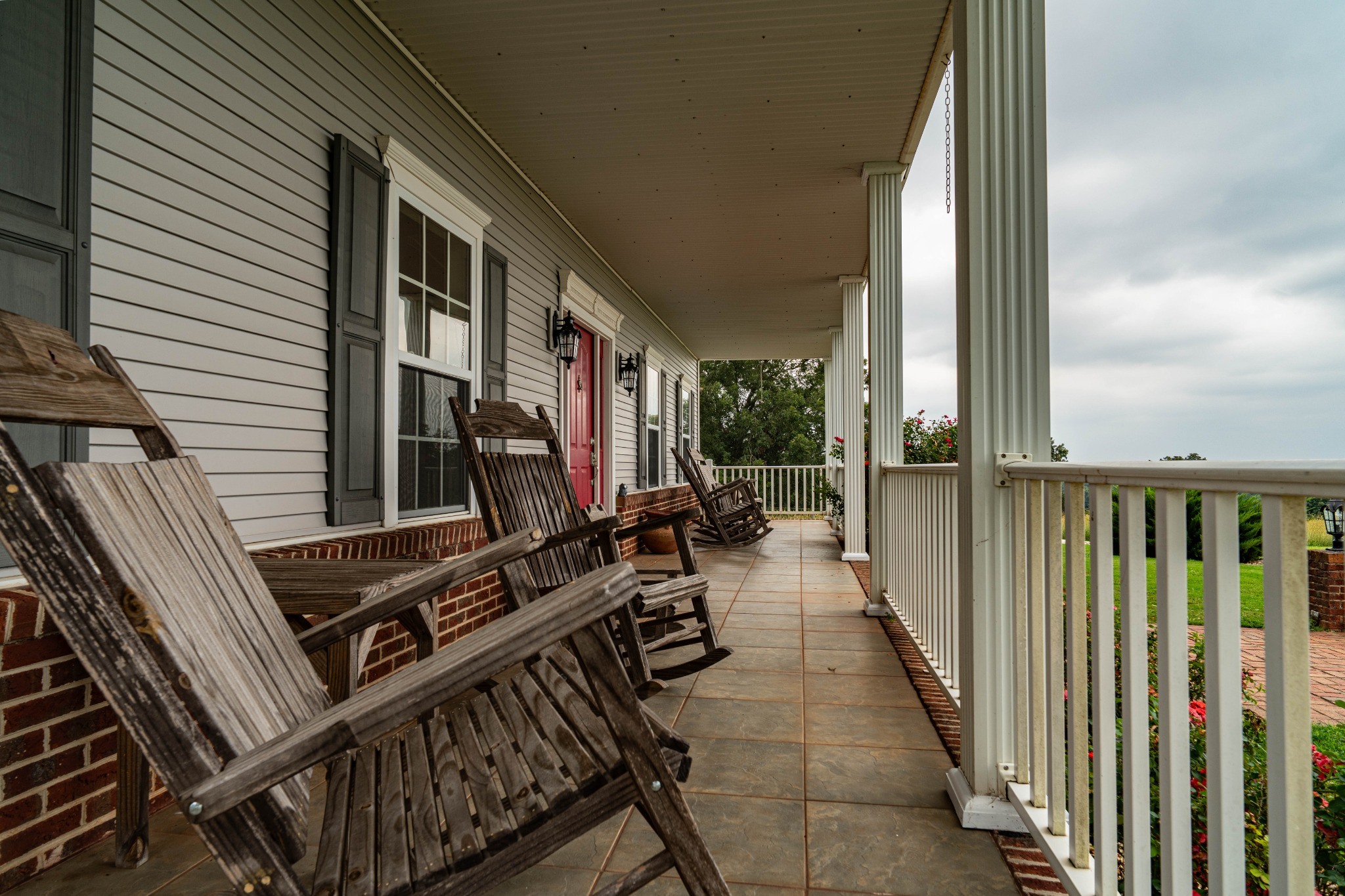 Covered porch with rocking chairs — photography by Andrew Frady